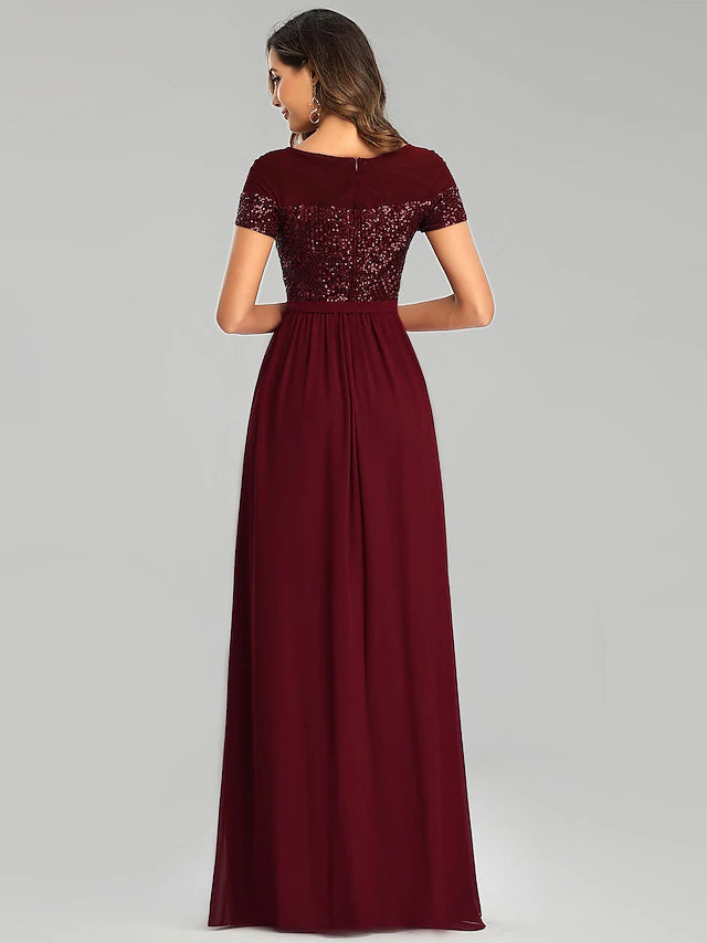 Full view of the bridesmaid dress, highlighting the sash or ribbon detail.