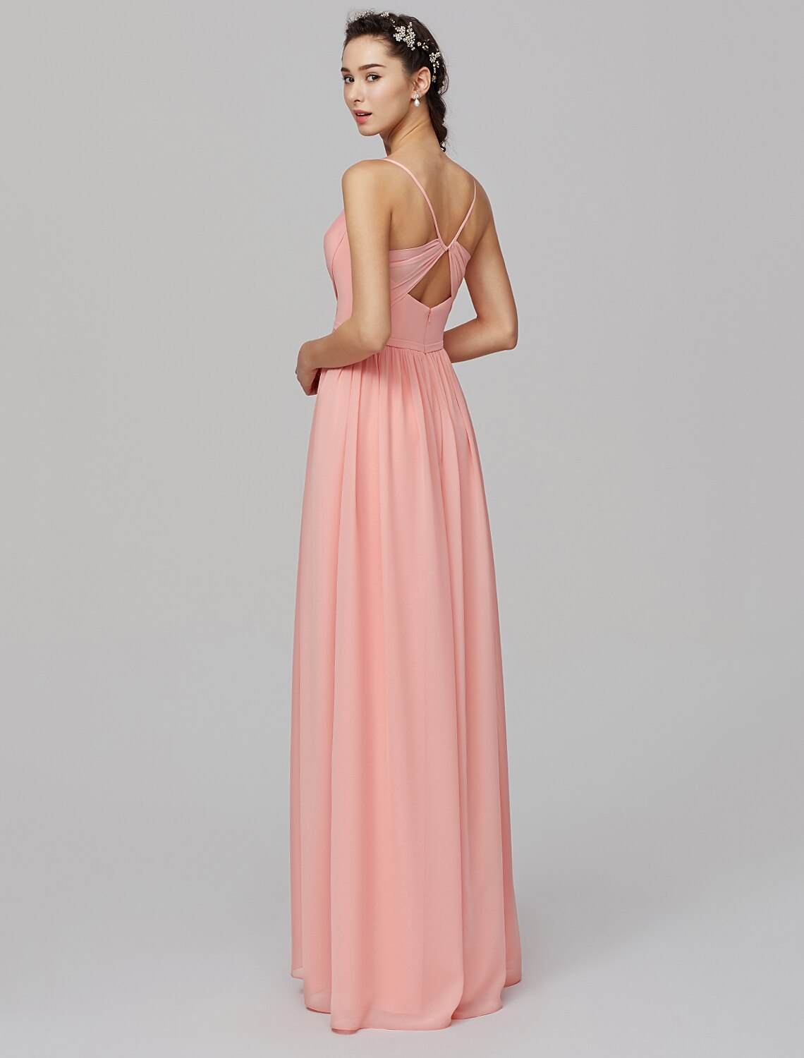 Model posing in the floor-length chiffon dress, showcasing its elegant drape.