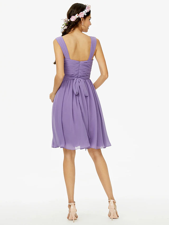 Back view of A-line chiffon bridesmaid dress with bow detail.
