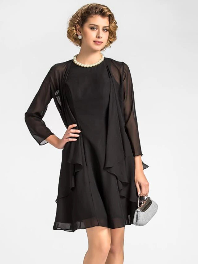Side view of the woman in the knee-length Mother of the Bride dress.
