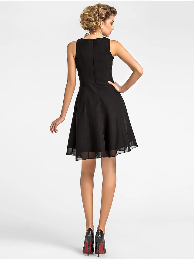 Detail of the chiffon fabric and draping on the knee-length dress.