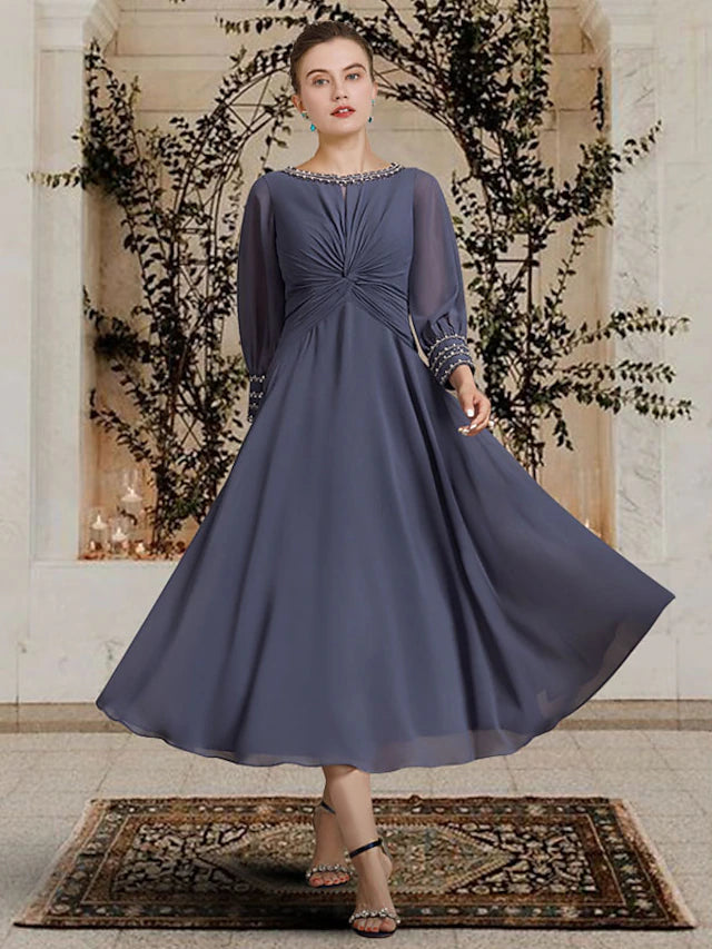 Elegant A-Line Mother of the Bride dress in chiffon with jewel neck, long sleeves, and delicate beading.