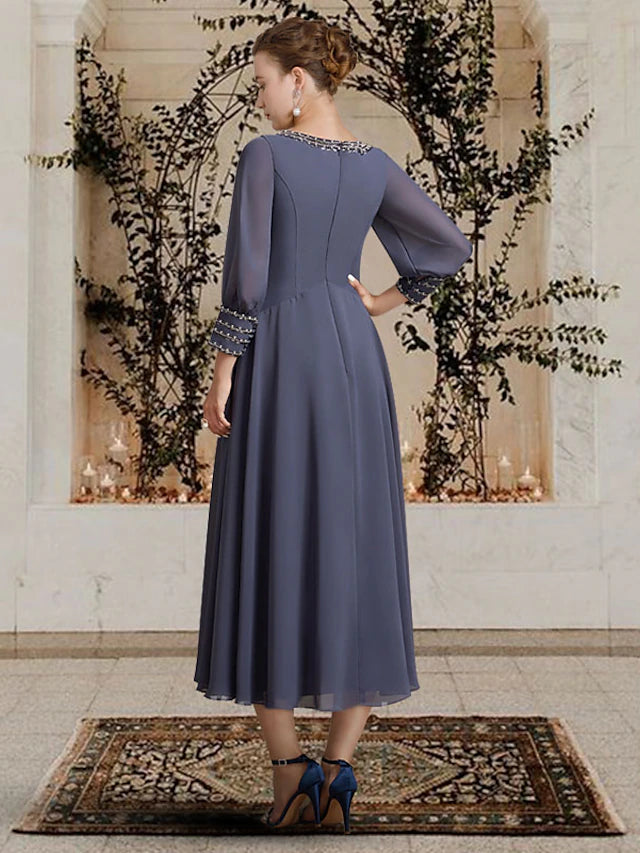 Back view of the elegant A-Line Mother of the Bride dress, showcasing the tea length and flowing chiffon fabric.