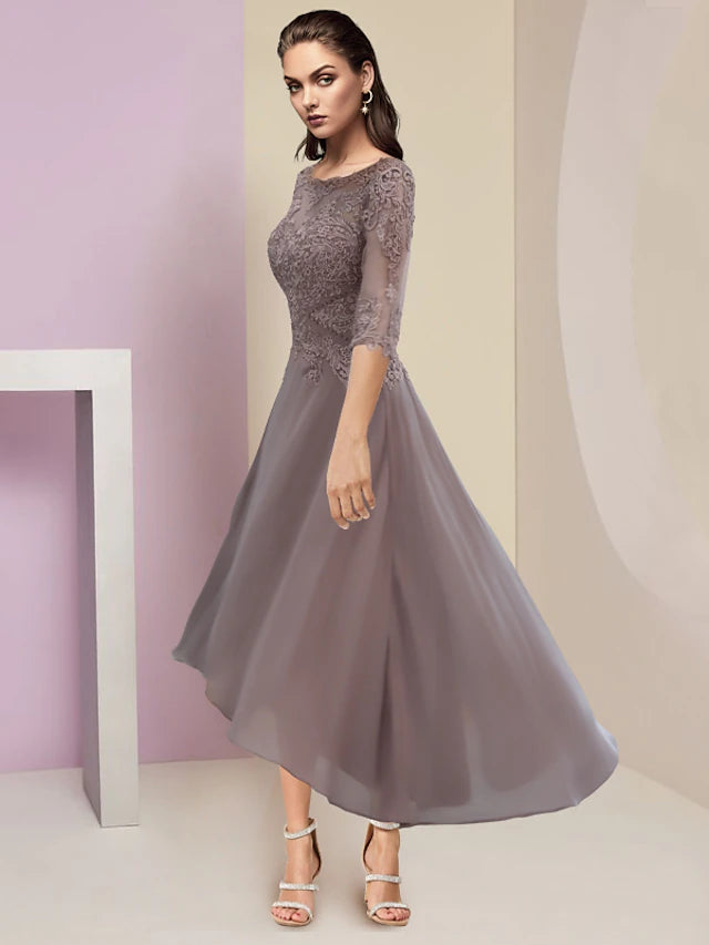 Close-up of delicate lace appliques and chiffon fabric on the dress.