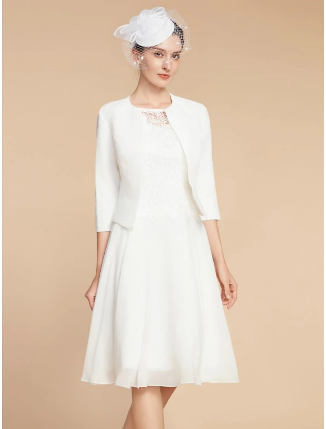 Elegant A-line chiffon lace dress with jewel neck and 3/4 sleeves.