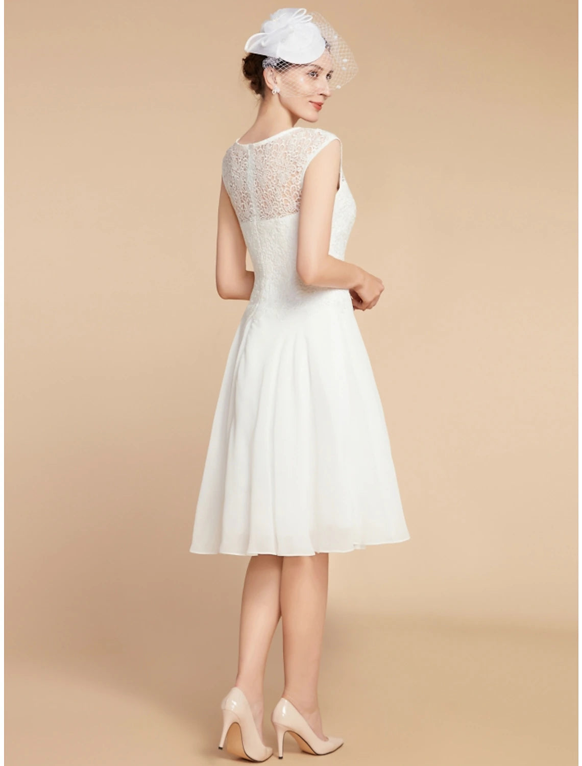 Close-up of the chiffon and lace fabric texture on the dress.
