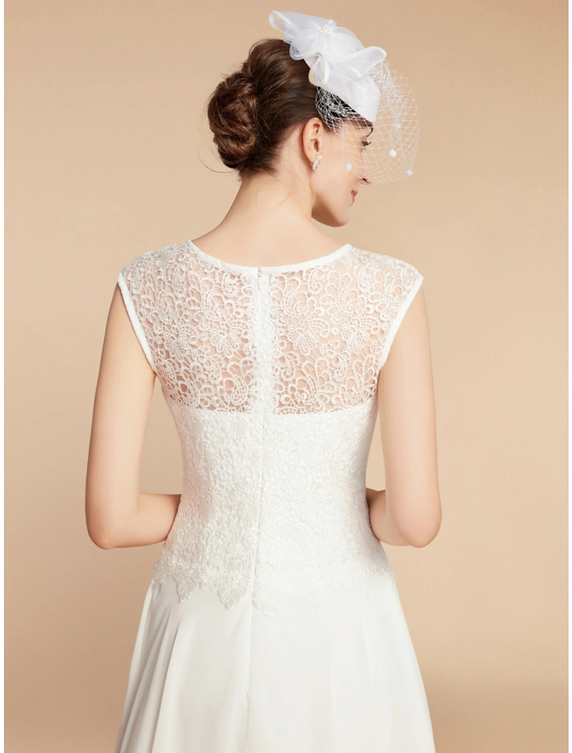 Model wearing the elegant two-piece dress for a formal occasion.