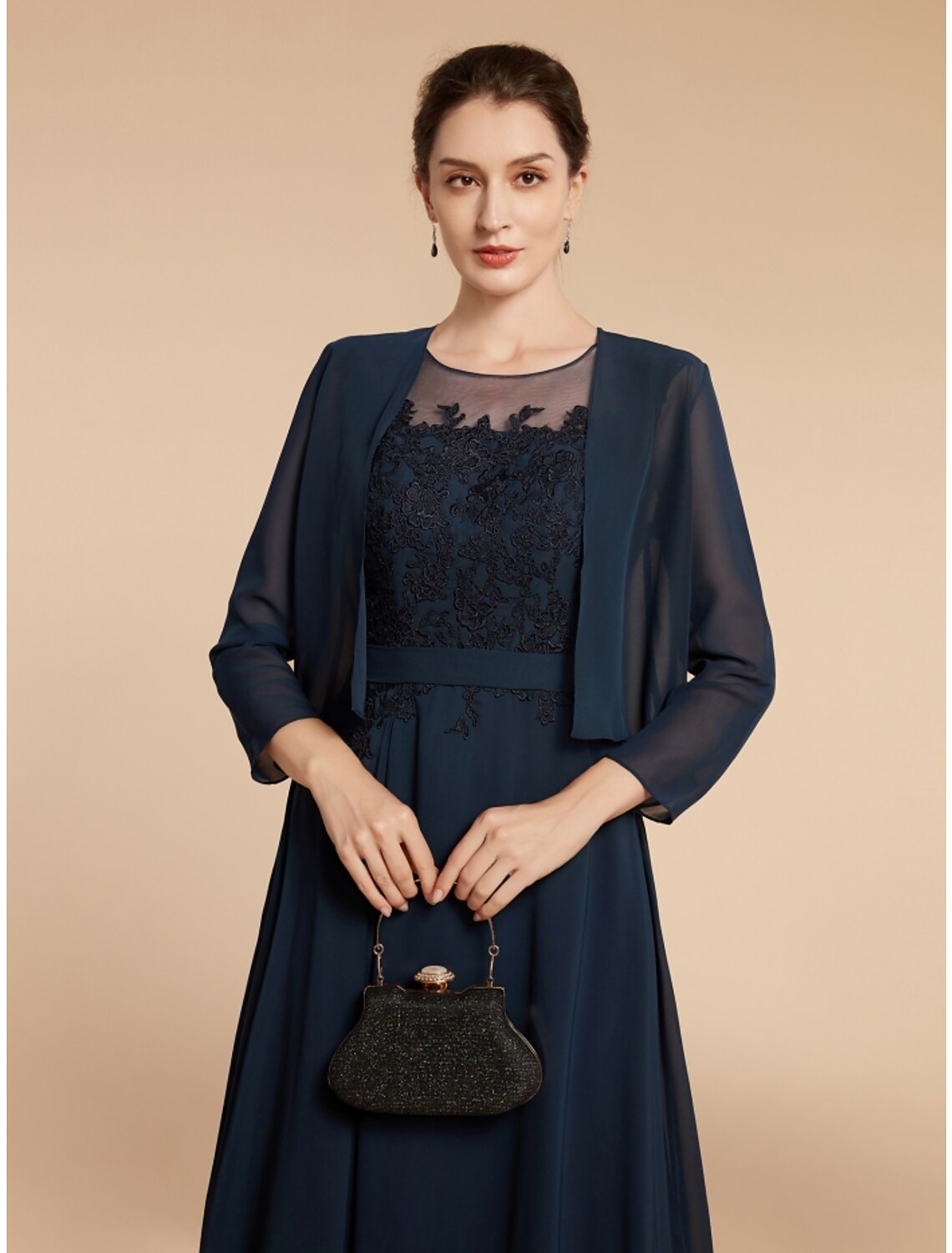 Full length view of the navy blue A-line dress, showcasing its elegant design for special occasions.