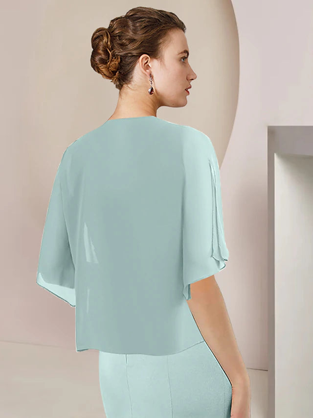 Back view of the formal dress, showcasing lace and sequin appliques.