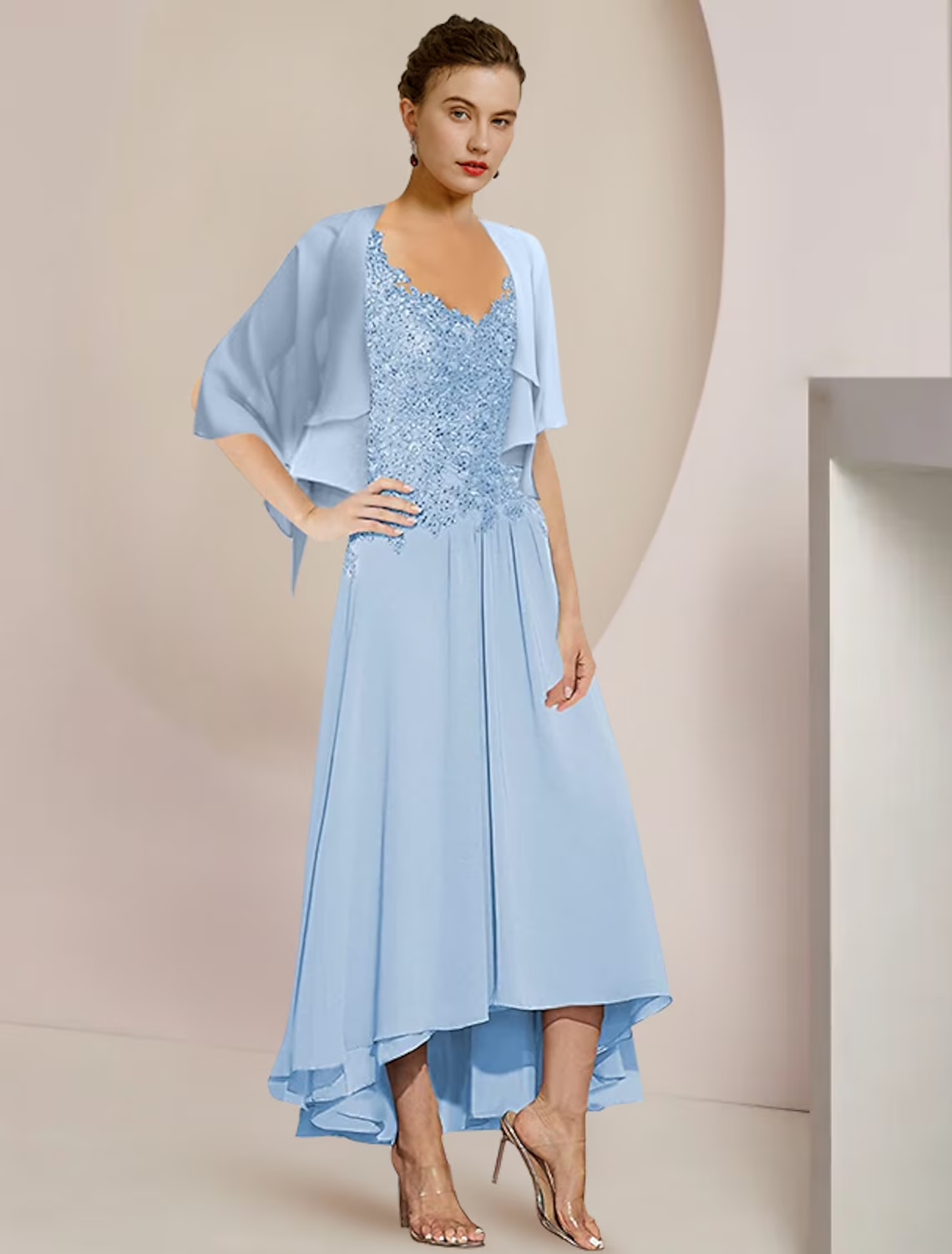 Close-up of the chiffon and lace fabric with delicate sequin appliques on the dress.