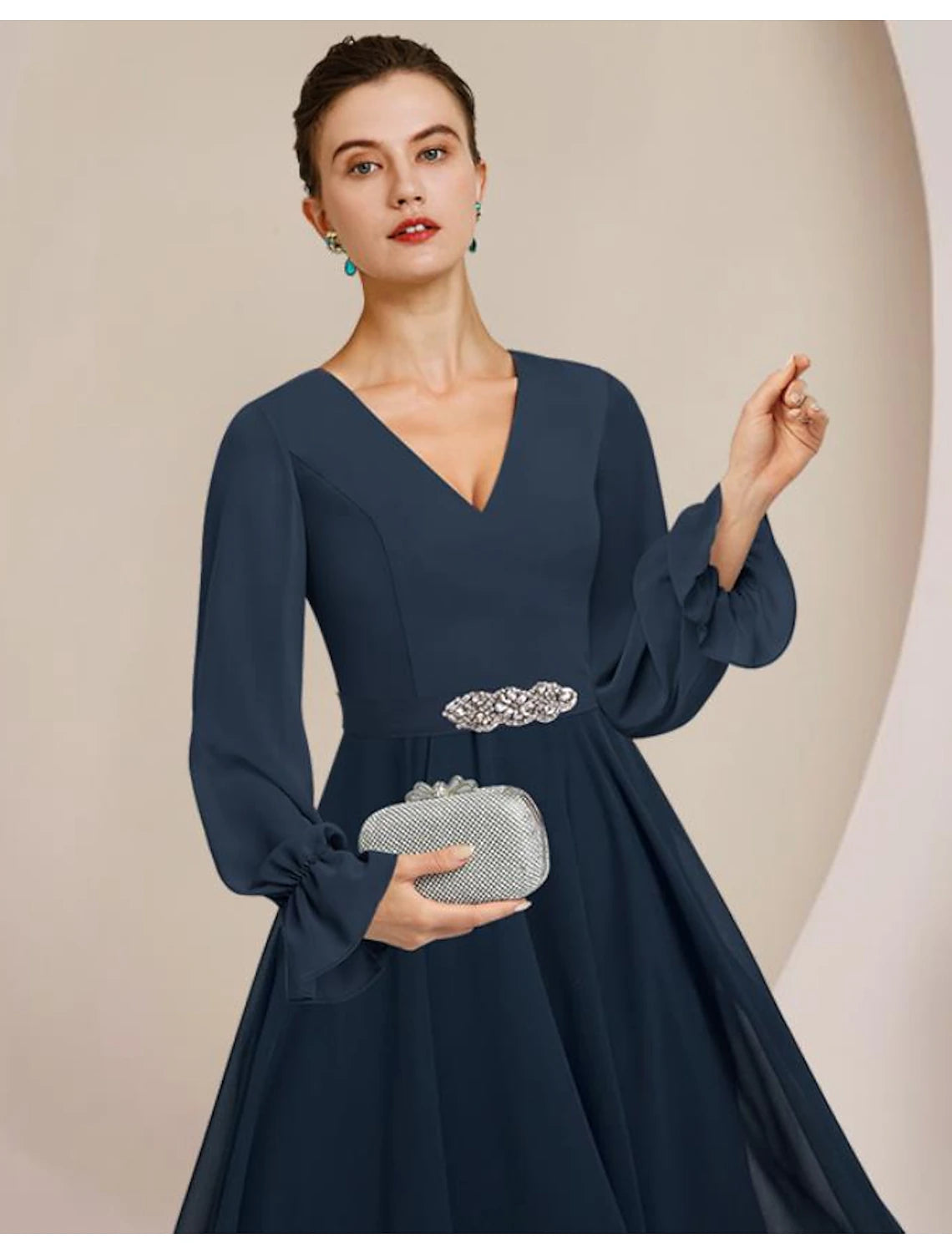 Back view of the A-line chiffon dress, showing asymmetrical hemline.