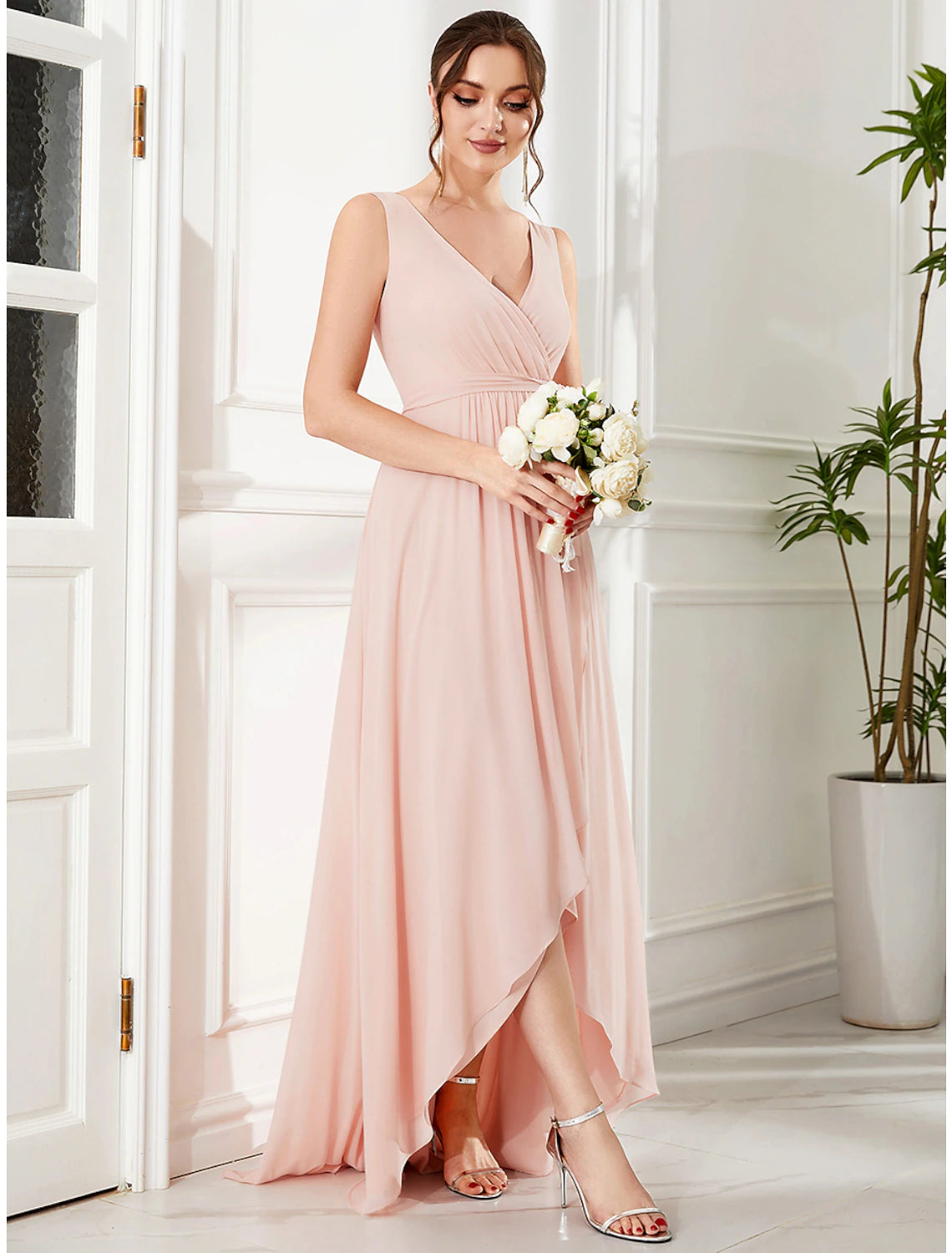 Back view of the elegant A-line chiffon dress with spaghetti straps.