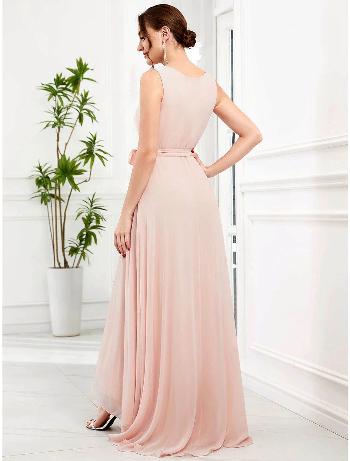 Woman posing in the A-line chiffon maxi dress, showcasing its flowing silhouette.