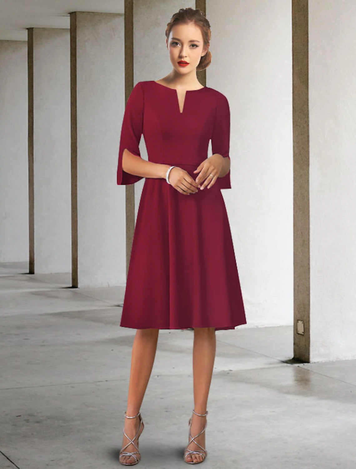Elegant A-line chiffon Mother of the Bride dress with jewel neck and half sleeves.