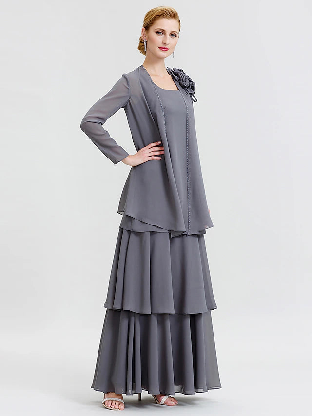 Close-up of floral beading and tiered chiffon fabric on the dress.