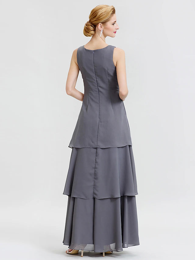 Detail of the scoop neckline and long sleeve of the chiffon dress.