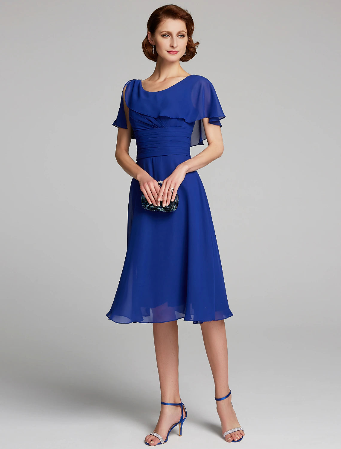 A-Line Mother of the Bride dress in chiffon with cowl neck and short ruffled sleeves.