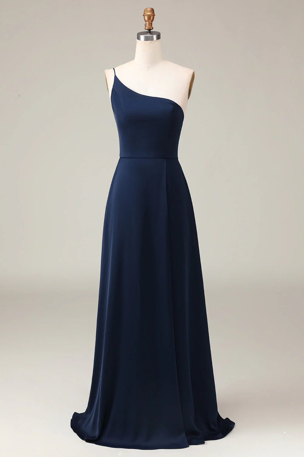 Side profile of a woman wearing an A-line chiffon one-shoulder bridesmaid dress.