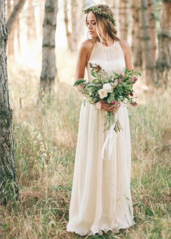 Elegant A-line chiffon wedding dress with V-neck and long flowing skirt.