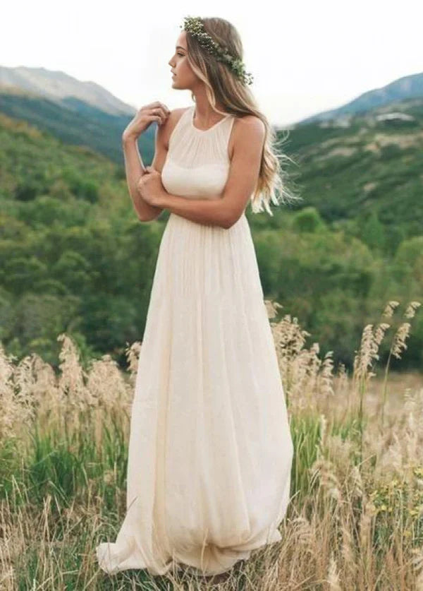Side profile of a sleeveless A-line chiffon bridal gown.