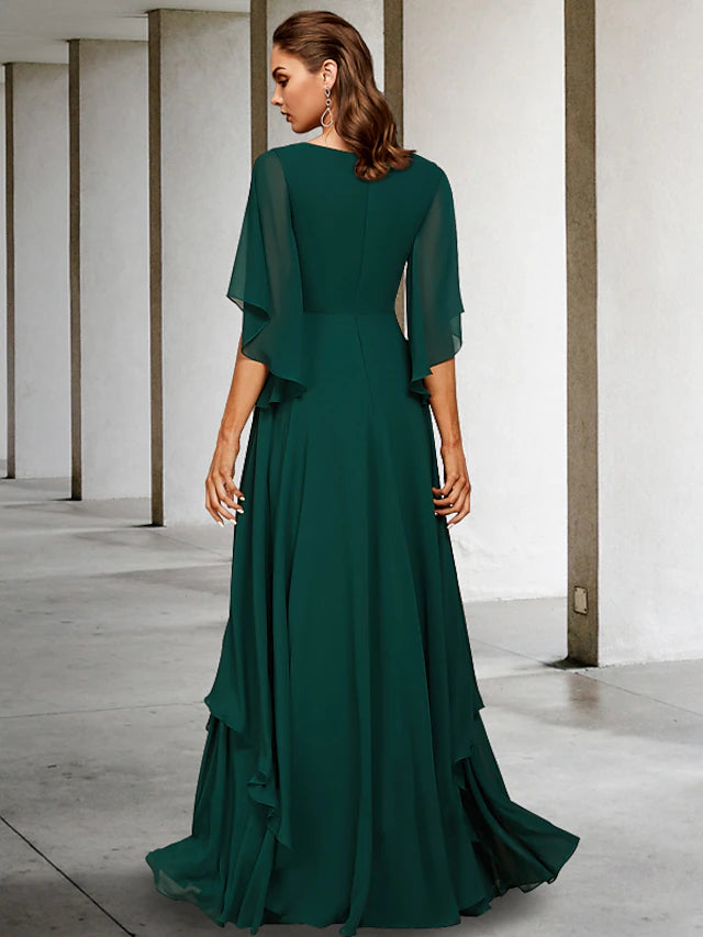 Close-up of the V-neckline and half sleeves on the chiffon formal dress.