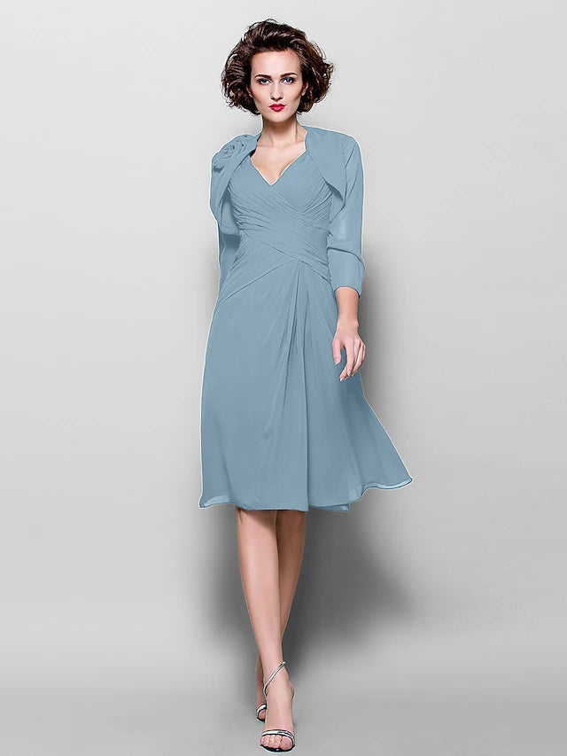 Back view of the A-line chiffon dress, showing the knee-length hem and flowing fabric.