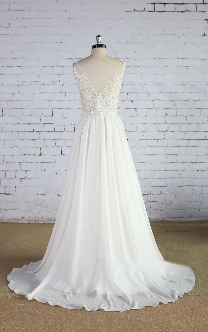 Back view of an A-line chiffon wedding dress with lace details.