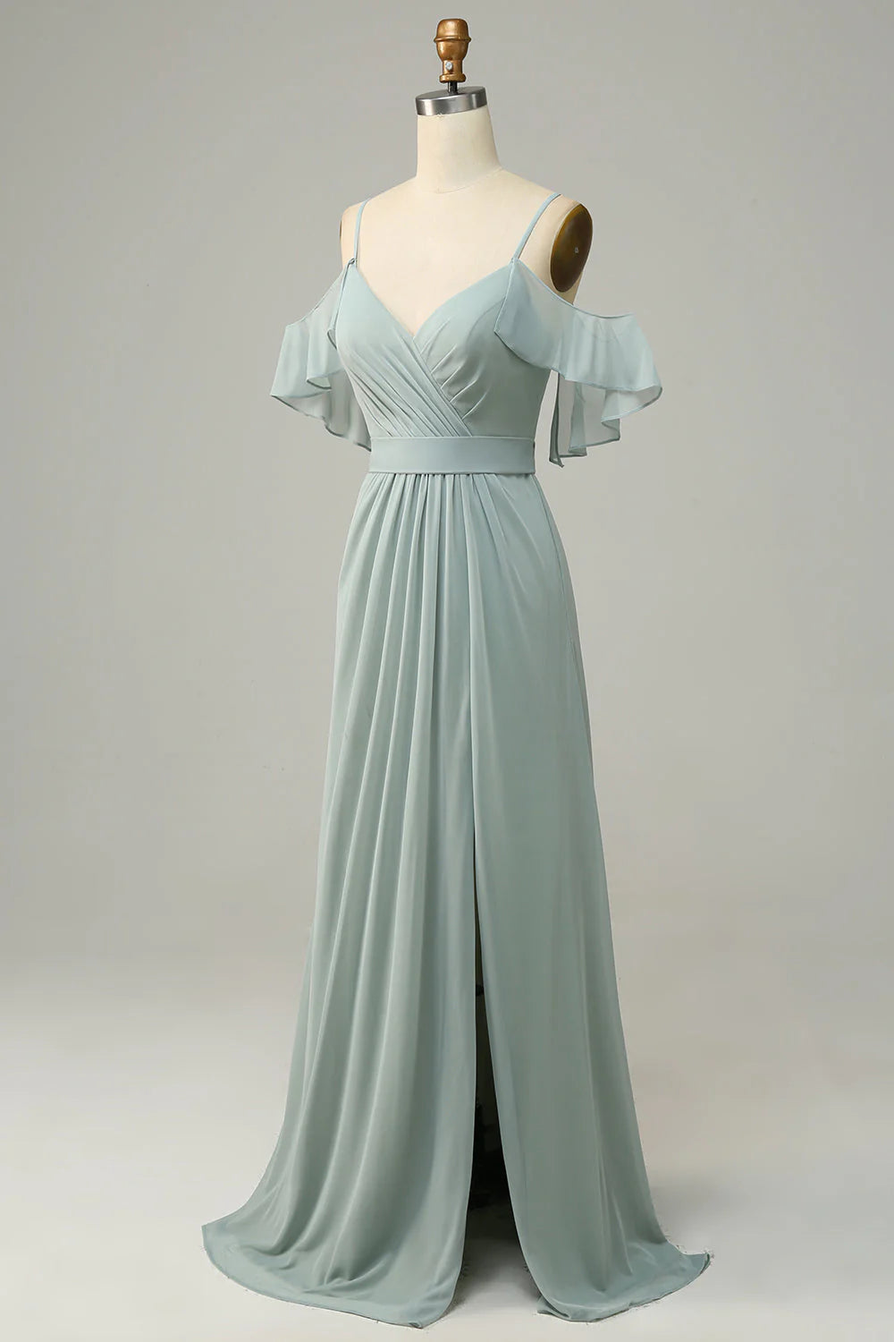 Full length view of an A-line cold shoulder dress, suitable for bridesmaids, in a sage green color.