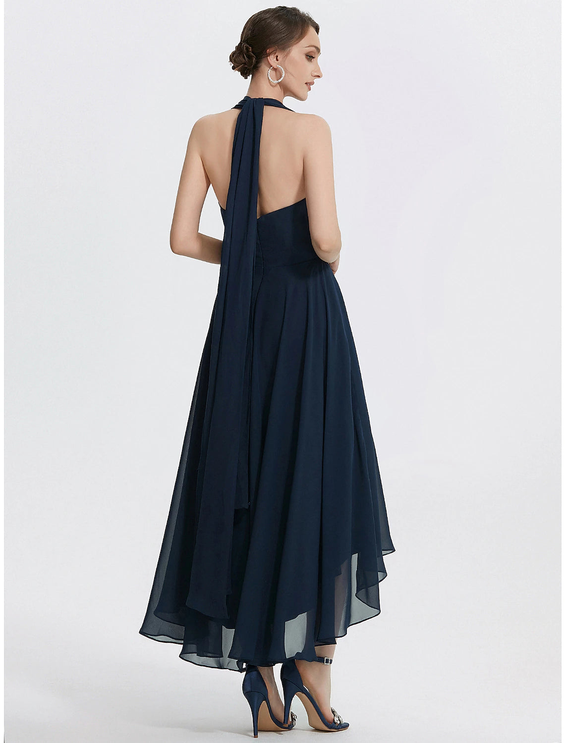 Back view of the tea-length ruched chiffon dress.