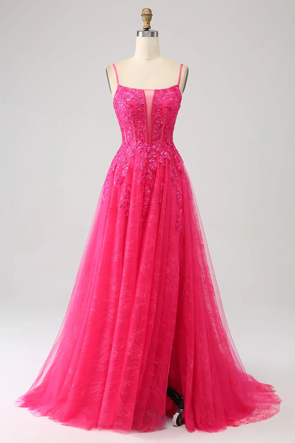 Full view of a fuchsia A-line corset lace prom dress with a high slit.