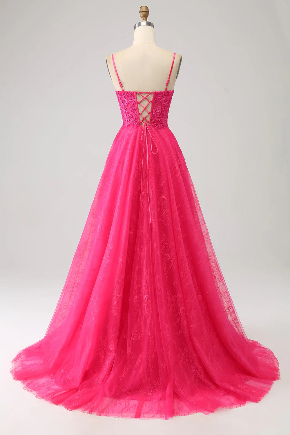 Side view of the fuchsia A-line corset lace gown, highlighting the lace bodice.