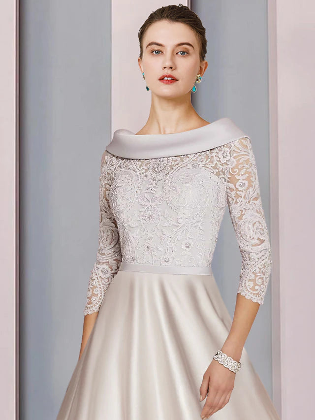 Back view of the A-Line tea length formal dress with lace and beading.
