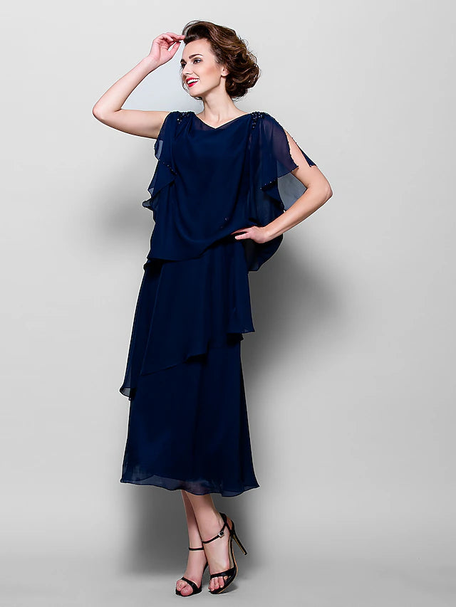 Close-up of the cowl neck and short ruffled sleeves on the elegant dress.