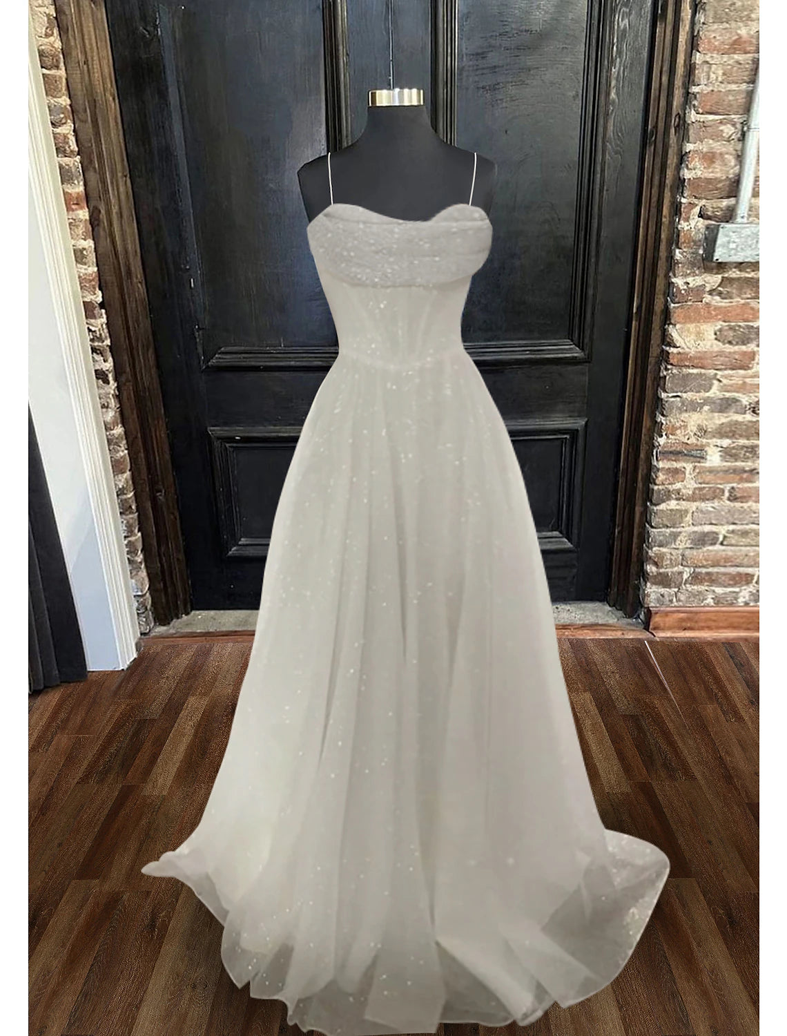 Back view of the A-line floor length evening gown with glitter tulle fabric.