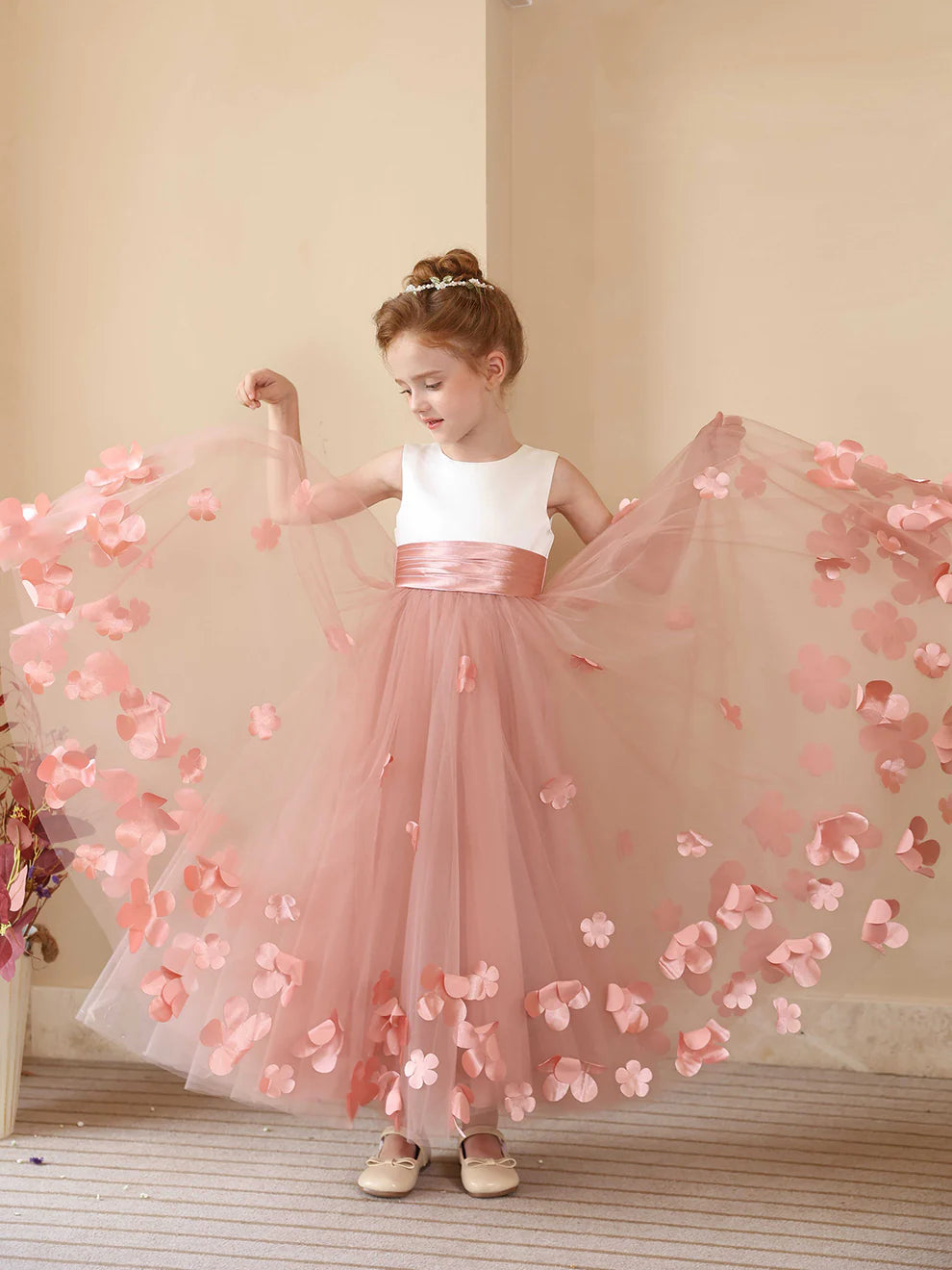 Side view of an A-line flower girl dress, showcasing the floor-length design.