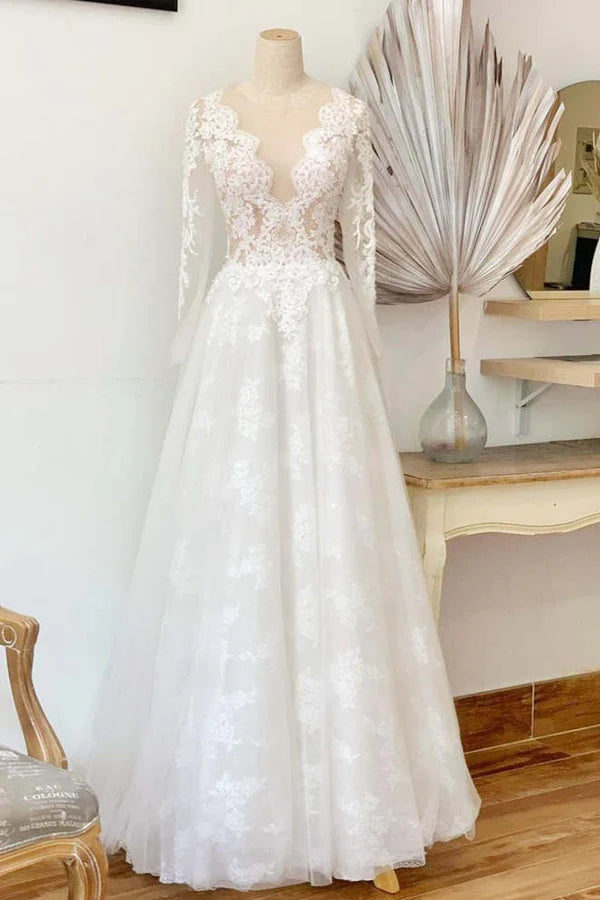 Model wearing an elegant white lace long sleeve crew neck wedding dress.