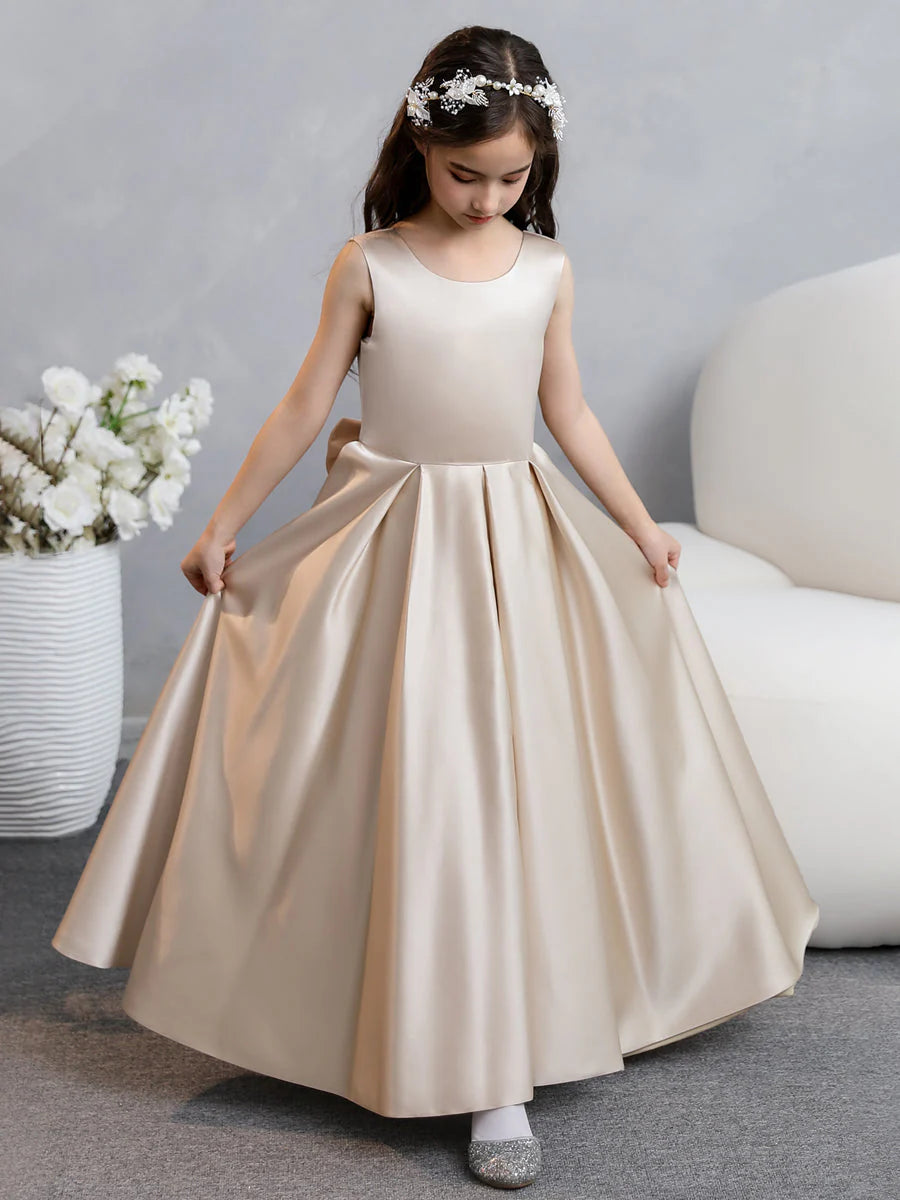 Back view of the white satin flower girl dress, highlighting the elegant bowknot detail.