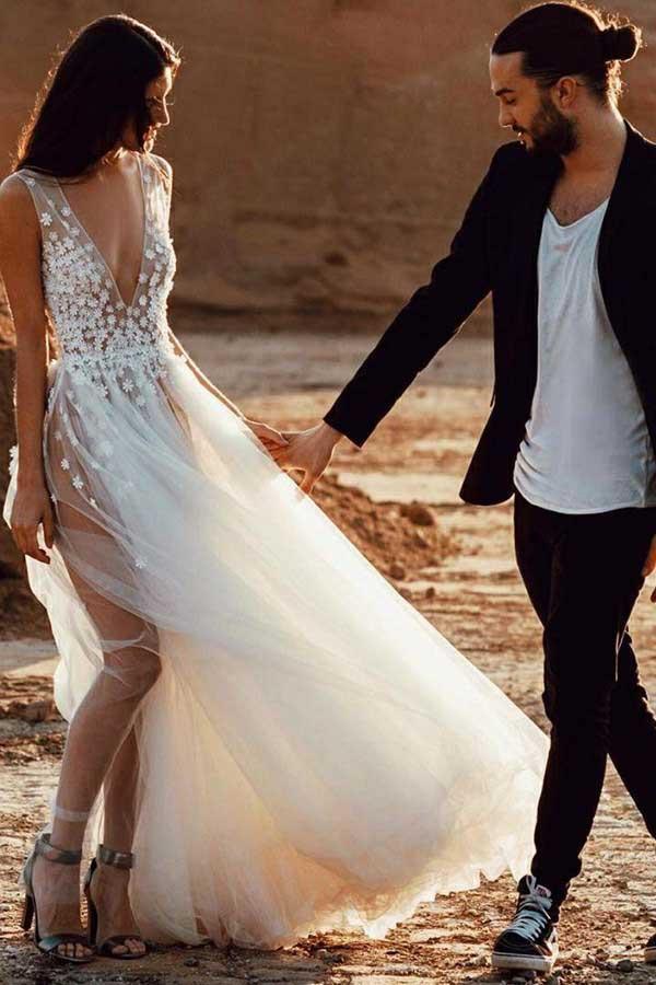 Full length view of an A-Line Deep V-Neck Tulle Wedding Dress with appliques.