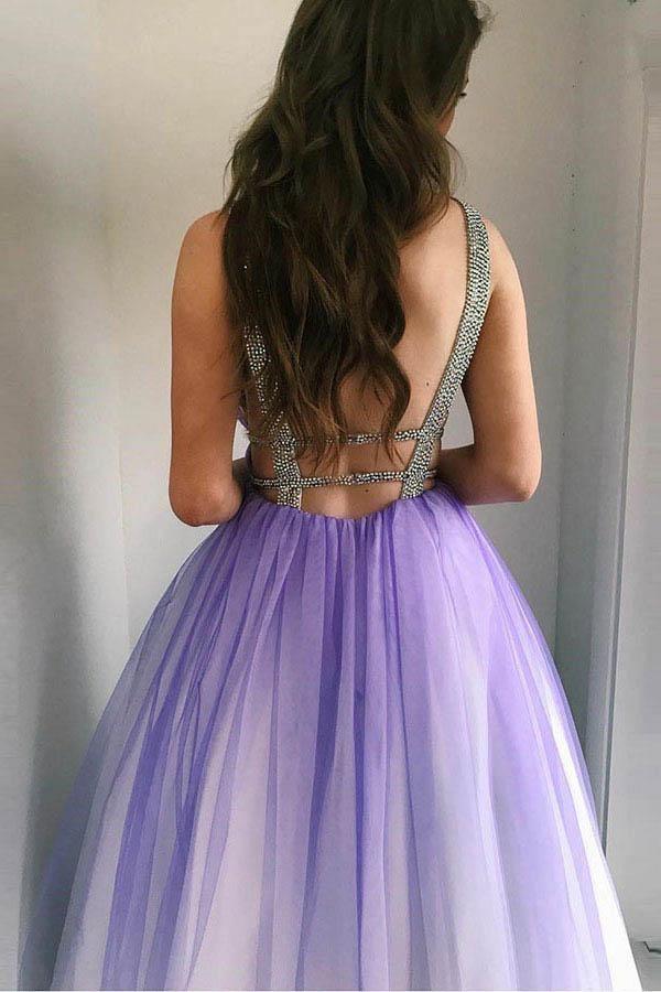 Full length view of a backless purple prom dress in A-line style.