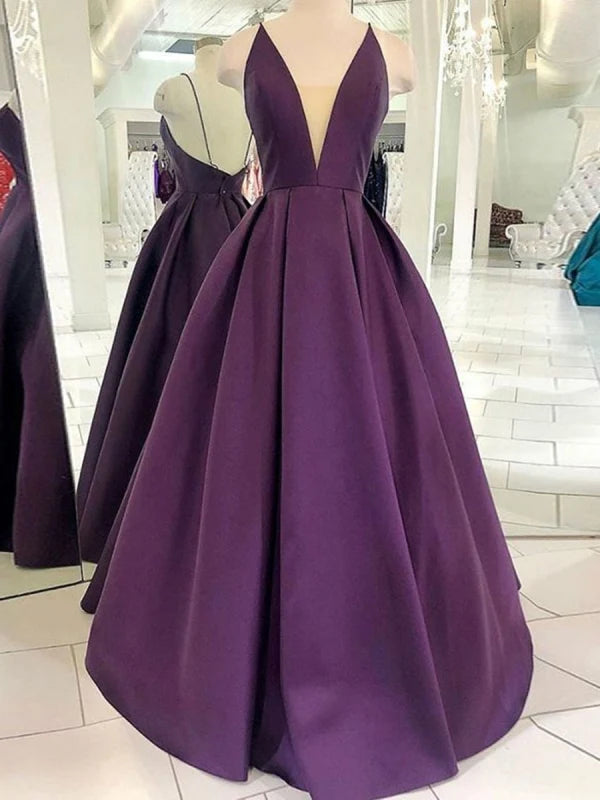 Elegant woman wearing a deep V-neck backless satin maxi prom dress.