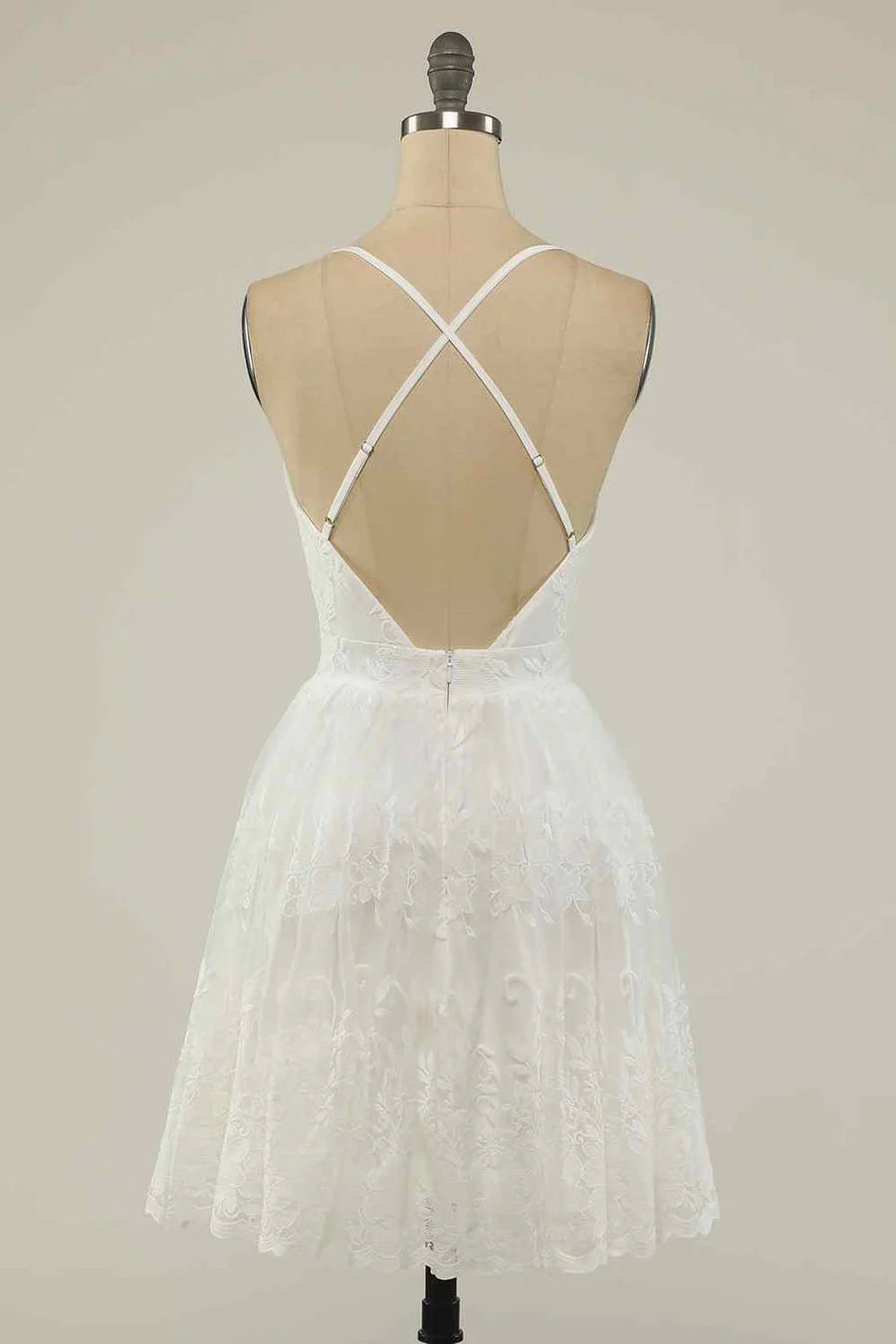 Back view of an A-line deep V-neck homecoming dress showing crossed straps.