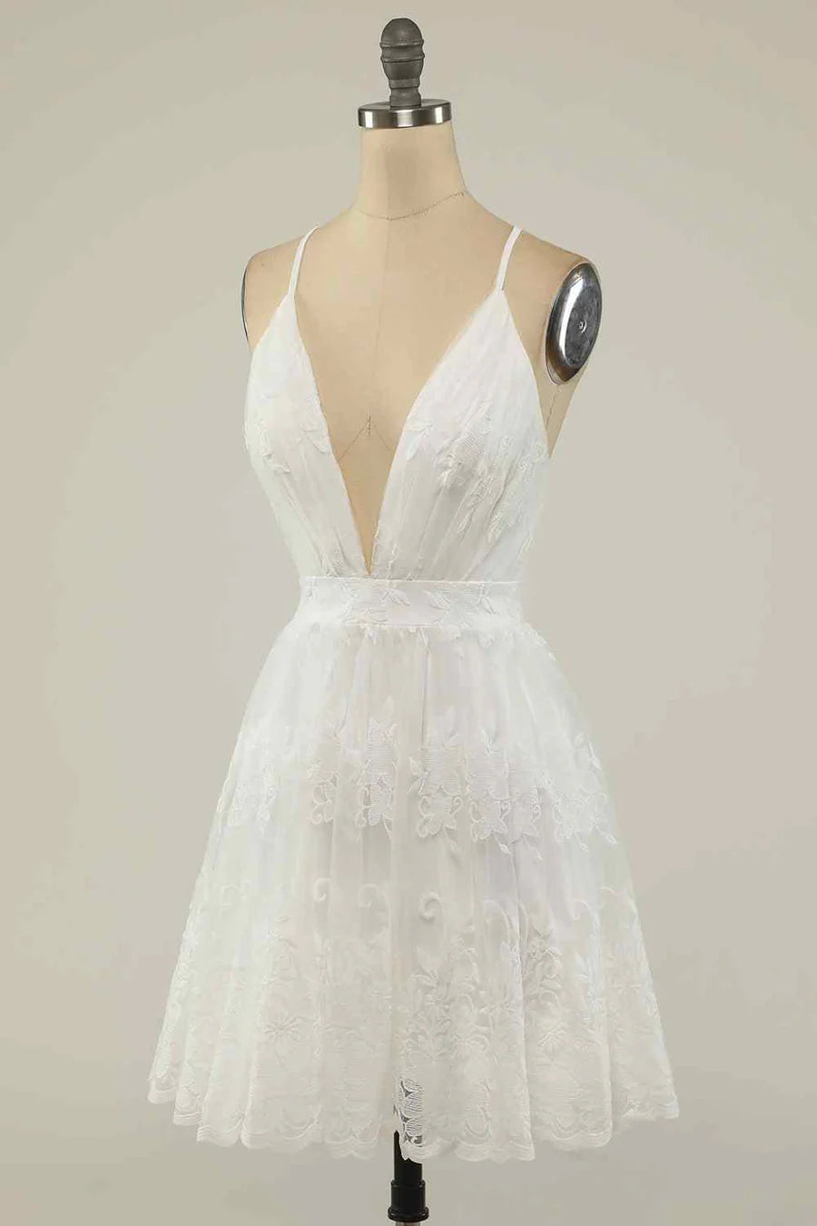 Close-up of intricate embroidery detail on an A-line homecoming dress.