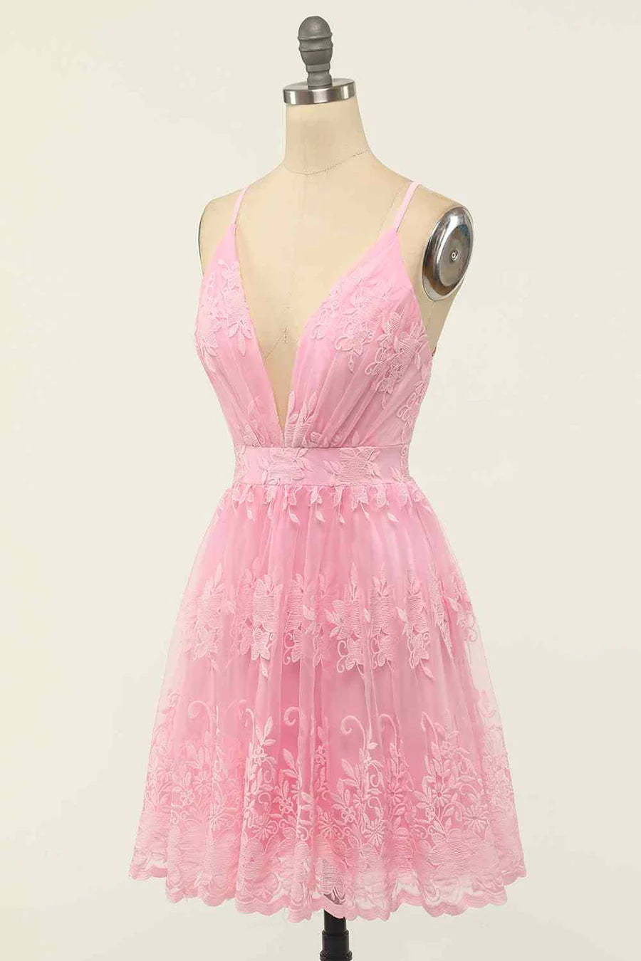 Full length view of an A-line deep V-neck homecoming dress.