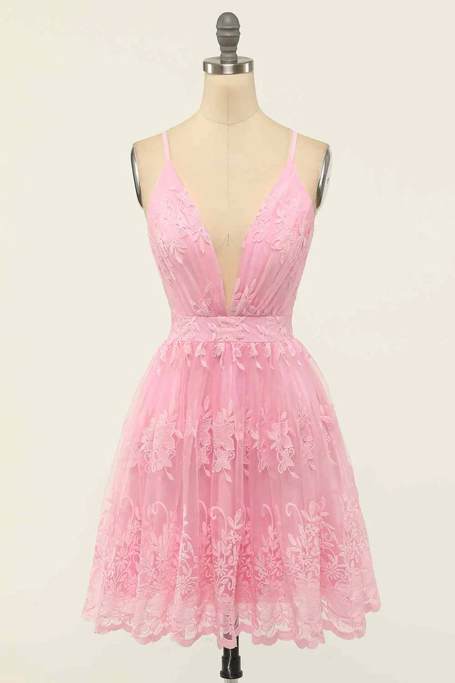Model wearing an A-line deep V-neck homecoming dress.