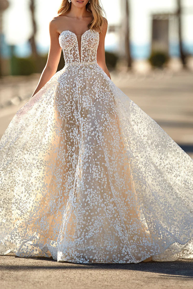 Elegant A-line lace wedding dress with deep V-neckline.