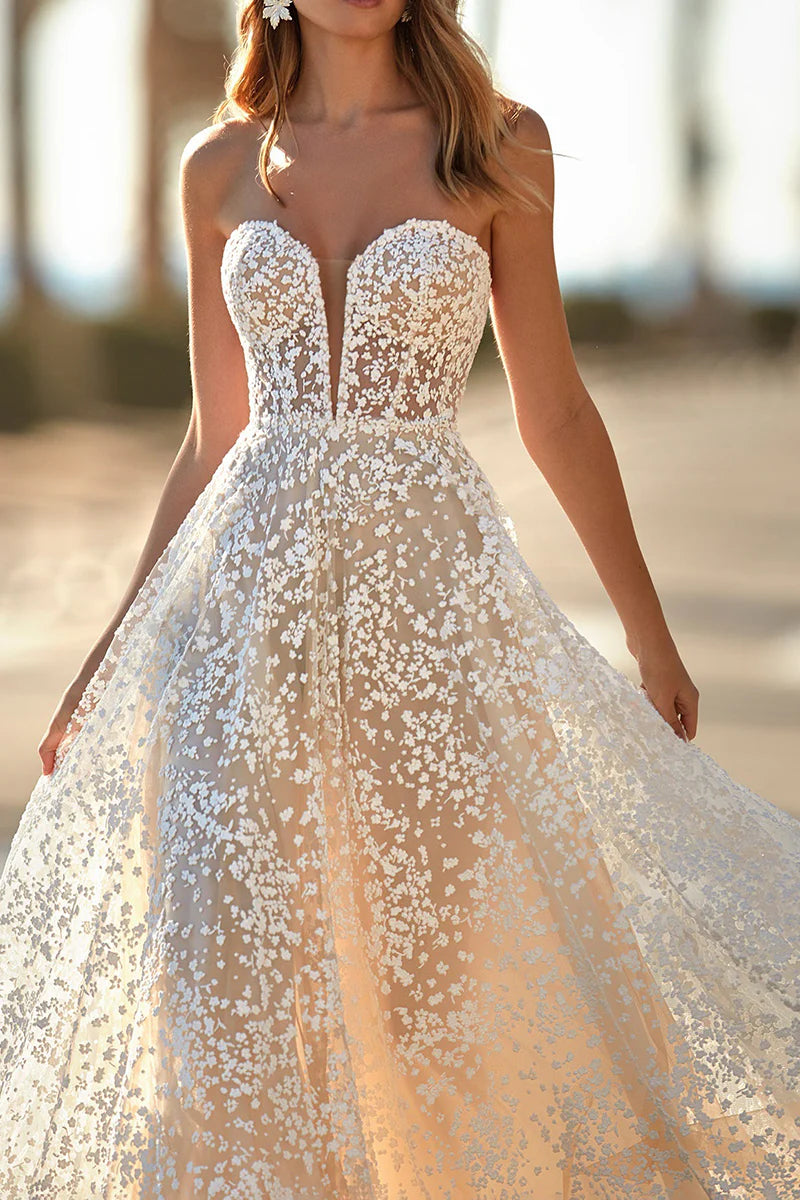 Close-up of the intricate lace detail on an A-line wedding dress.