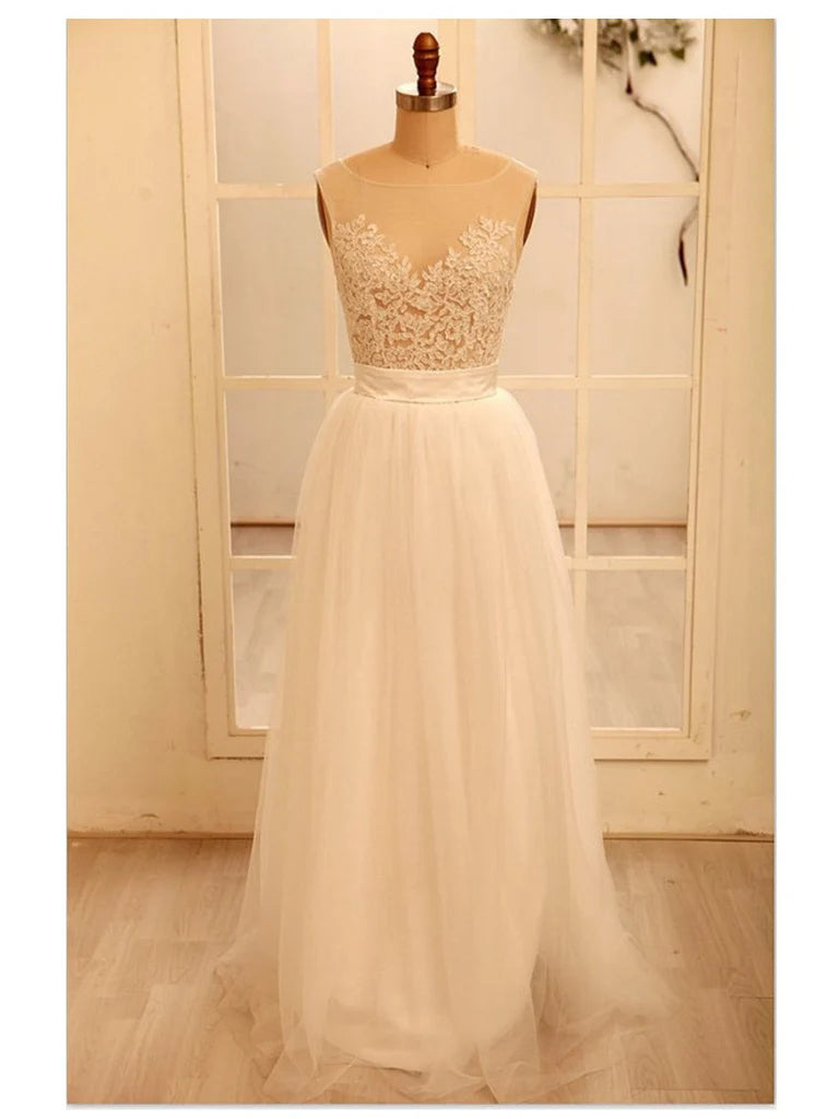 Woman wearing an elegant A-line deep V-neck lace wedding or prom dress.