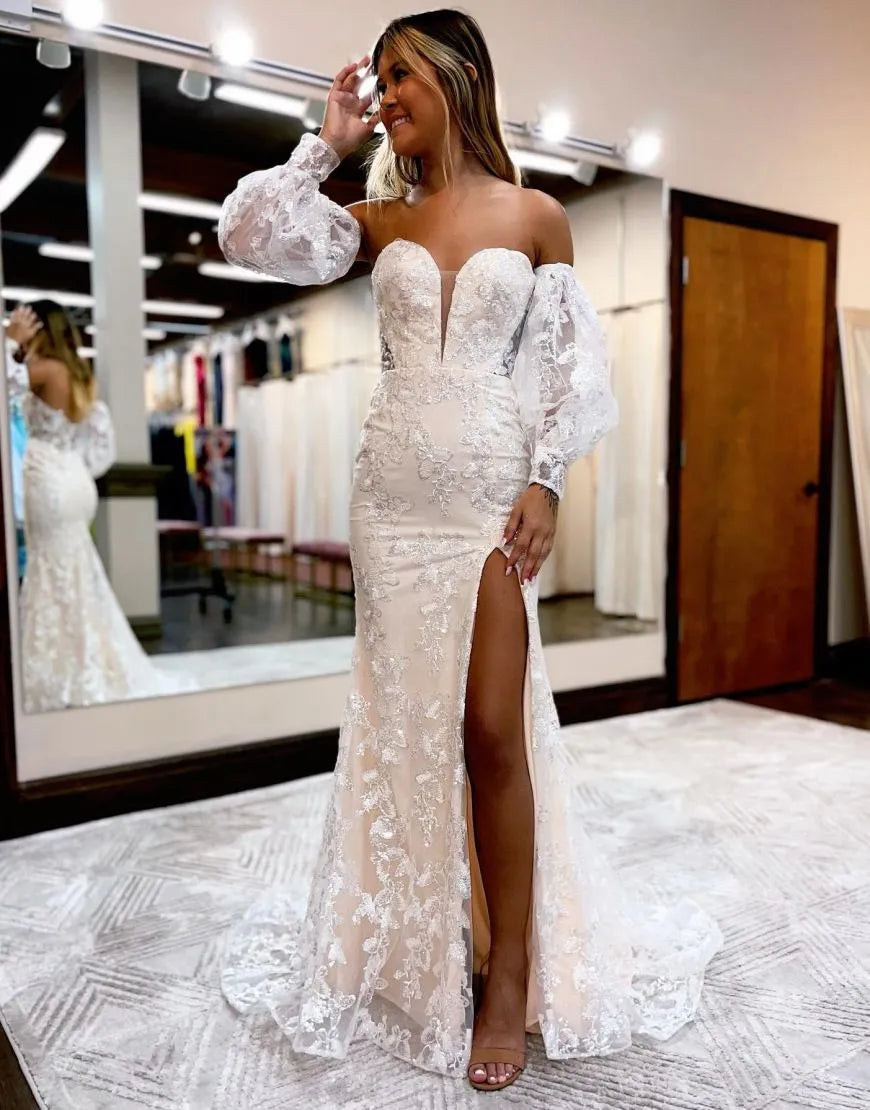 Close-up of the deep V-neck and long sleeves of a formal dress.