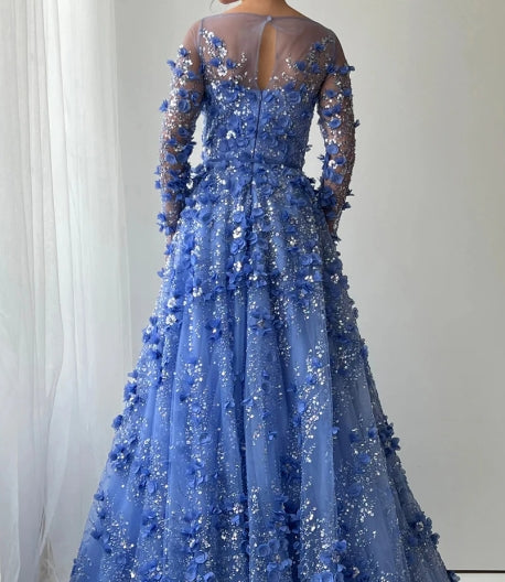 Side view of the sequined A-line prom dress, showcasing pleating and long sleeves.