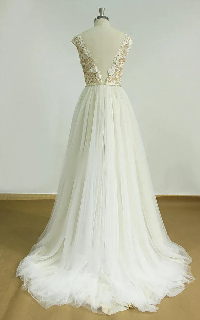 Back view of a white deep V-neck tulle lace wedding dress, highlighting the open back.